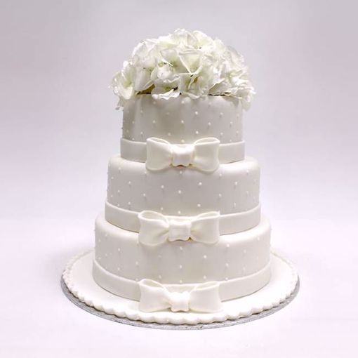 Afbeelding van Wit strik en bloemen taart